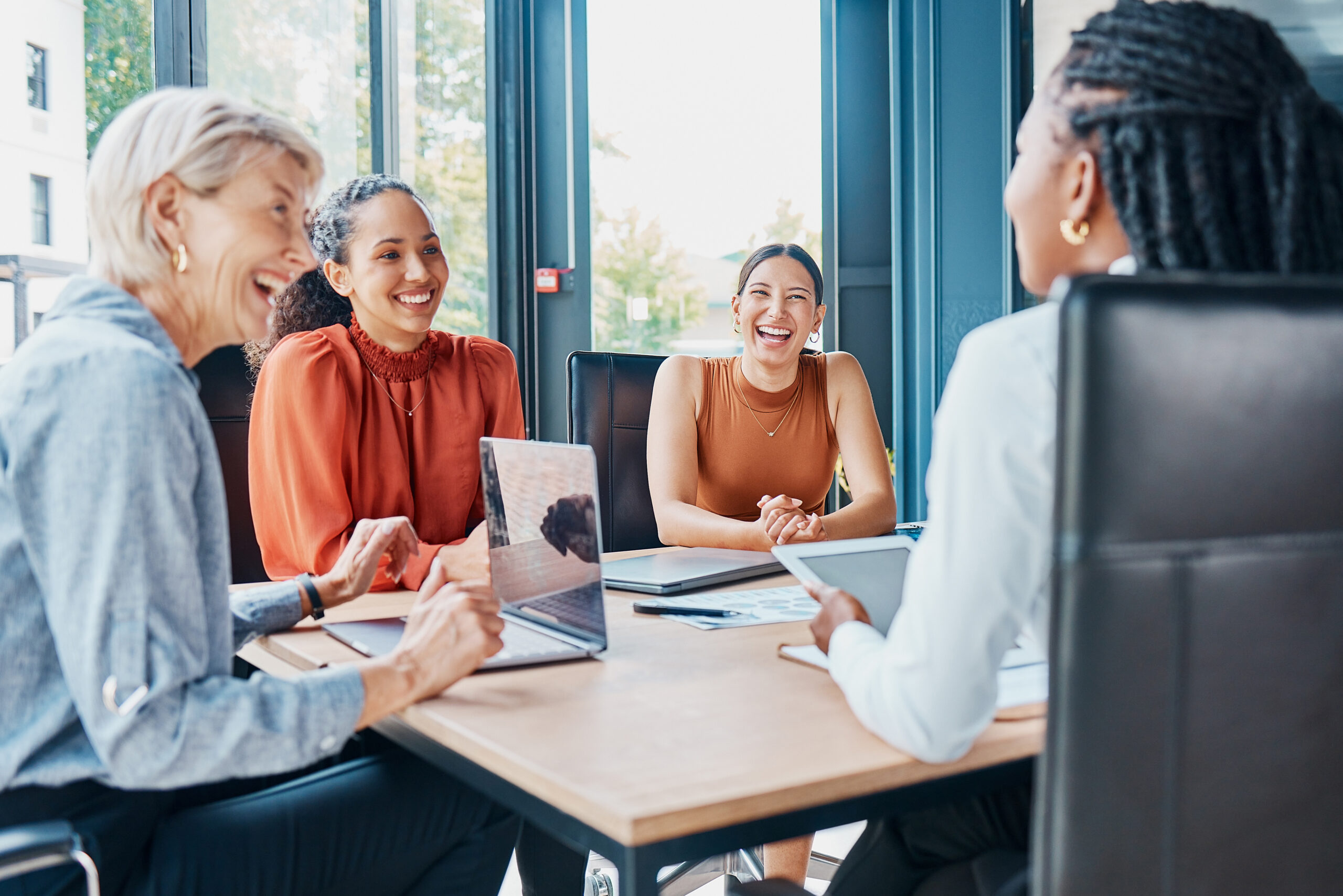 Laughing, planning business and women in a meeting for strategy, teamwork and a workforce team